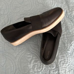 Black leather slip ons